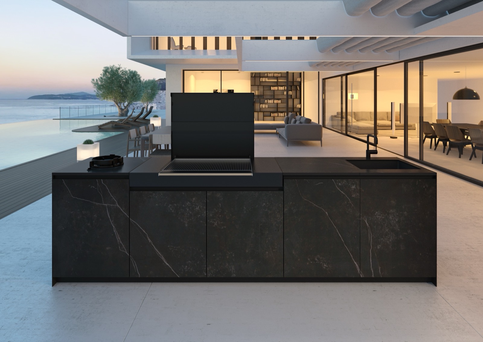 Dark stone kitchen island on a terrace at dusk